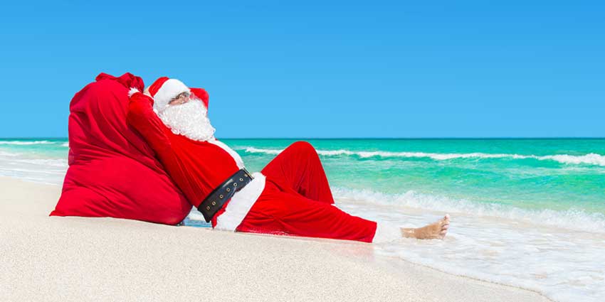 Father Christmas On Beach