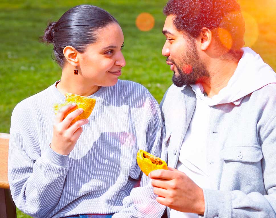 Couple eating patties